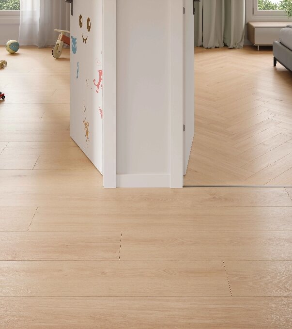 Interior with the same decor laid as plank and herringbone across two rooms
